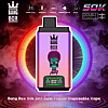 Pink-to-purple Bang Box disposable vape with crown logo and green zombie face, neon ring backdrop, 50k 2in1 Dual Flavor.