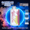 Promotional graphic showing a white-and-pink Gazzbar Ice God disposable vape with brushstroke decoration centered in a neon-blue halo over red and blue vapor, accompanied by text and icons advertising 50K puffs, up to 50,000 puffs, five levels of personalized coolness, and a bite-friendly mouthpiece.