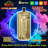 Shiny gold disposable vape device labeled “Blueberry Raspberry” centered inside a neon circle with swirling purple, pink and teal vapor and surrounding logos and text advertising Bang Gold 42000 puffs, E‑Shisha Head, Type‑C, 1000mAh battery, 30ml liquid and mesh coil.