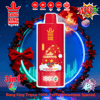 Bright red Bang King Vapen disposable device centered in a festive wreath with poinsettias and a Santa hat, labeled 'Merry Christmas Strawberry Red Bull' and marked 'Triple 100K' with icons for 3-in-1, Type-C charging, 600mAh battery and 24ml×3 capacity.