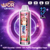 Pink disposable vape with a cartoon monkey on the label reading 12K PUFFS, set against a purple space background.