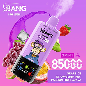 Purple disposable vape device branded BANG Bang Leader with a cartoon bored monkey, labeled 85,000 puffs and 3-in-1 grape ice/strawberry kiwi/passion fruit guava, surrounded by grapes, a strawberry, kiwi, passion fruit and an ice cube on a bright purple background