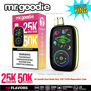 Förpackning och svart Mr. Goodie Dual Mode King engångsvape med färgglada konstverk med rymdtema med ett grönt UFO och planeter, en cirkulär LED-skärm och en rosa-gul låda som annonserar 25K boost/50K ekolägen, Mango Pineapple Ice-smak och en nikotinvarning.
