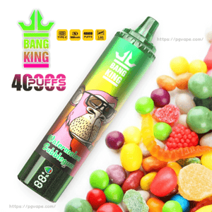 A green Bang King disposable vape device decorated with a sunglasses-wearing cartoon ape and labeled 'Watermelon Bubblegum' and '40,000 puffs', angled beside an assortment of colorful candies and gumballs.