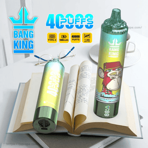 Two colorful Bang King disposable vape devices—tall green gradient cylinders with a cartoon monkey label and 
