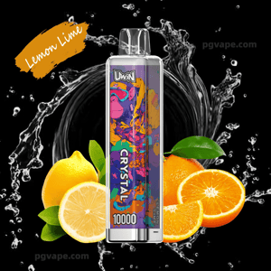 A clear-topped Uwin Crystal 10000 disposable vape with vibrant psychedelic monkey artwork centered on a black background with water splash effects, surrounded by whole and sliced lemons and oranges and a 'Lemon Lime' label.