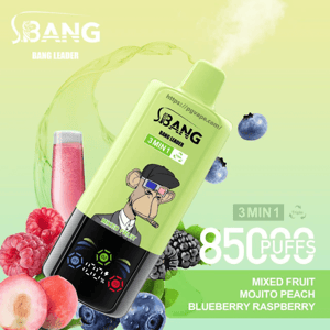 Light green disposable vape device labeled BANG Bang Leader with a cartoon ape wearing 3D glasses and a puff of vapor, tilted over raspberries, blueberries, blackberries, a peach and a pink drink, with on-image text advertising 3 in 1, 85,000 puffs and flavors Mixed Fruit, Mojito, Peach, Blueberry Raspberry.