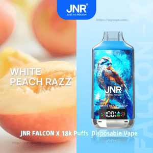 Close-up of a sliced white peach beside a blue JNR Falcon X disposable vape decorated with a colorful falcon illustration, a 100% digital display, and text reading WHITE PEACH RAZZ and 18k Puffs.