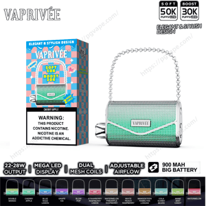 Vaprivée handbag-style disposable vape with a silver chain handle and green textured body shown next to its Cherry Apple retail box displaying a nicotine warning, puff-count badges (Soft 50K / Boost 30K), and icons for 22–28W output, adjustable airflow and a 900 mAh battery.