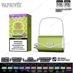 Green textured handbag-style Vaprivée vape device with a silver chain handle displayed next to its matching green checkered box labeled Soft 50K Boost 30K and a nicotine warning, with icons below indicating 22–28W output, mega LED display, dual mesh coils, adjustable airflow, 900 mAh battery, and multiple color options.