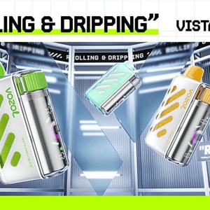 Tre glansiga Vista 40000 vaping-enheter med gröna, blågröna och gula accenter flyter i ett futuristiskt metalliskt showroom under en djärv rubrikläsning