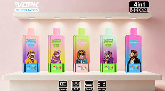 Five colorful gradient VOPK 'Four Flavors' disposable vape devices with cartoon animal illustrations on a lit display shelf against a pink background, showing '4in1 80000 puffs' branding and icons for 650mAh, 0.9Ω, USB Type-C and digital display.